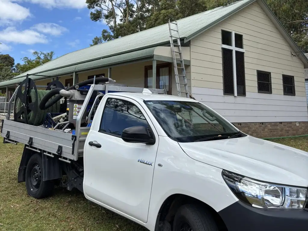 Ed's Property Maintenance gutter vacuum ute on site in Kiama
